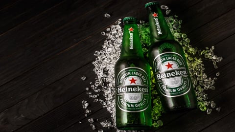 Two Heineken beers on ice